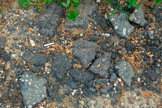 close-up of destroyed asphalt pavement