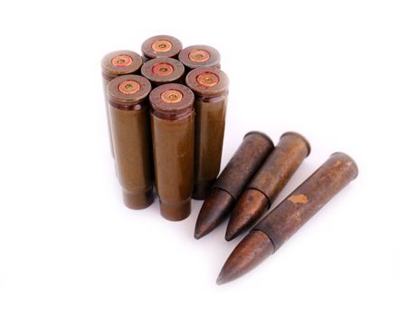 closeup of old used 7,62 mm shells (cartriges) of AK47 and bullets of World War I isolated on white