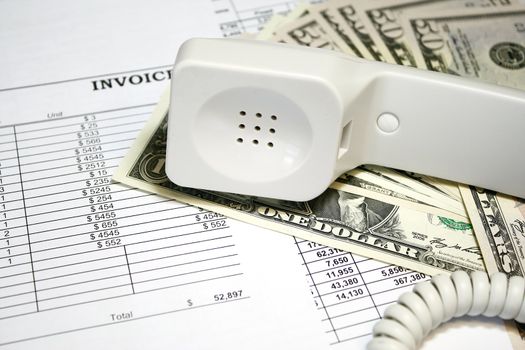 Telephone bills and invoices concept - with phone and billing documents
