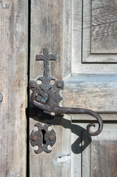 An antique door knob on an old church