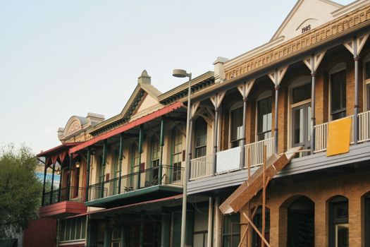 An old group of historic buildings in a Victorian style