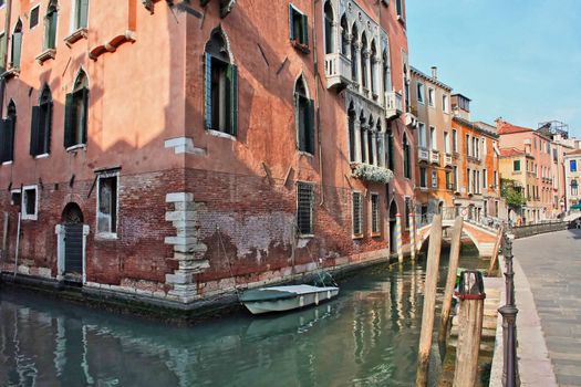A home in venice on the water with a boat outside the door