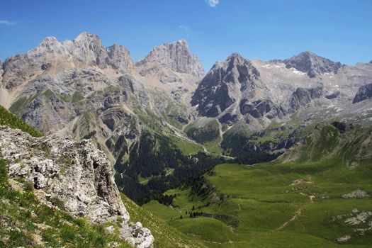 summer vief of italian dolomites with mount Marmolada on background