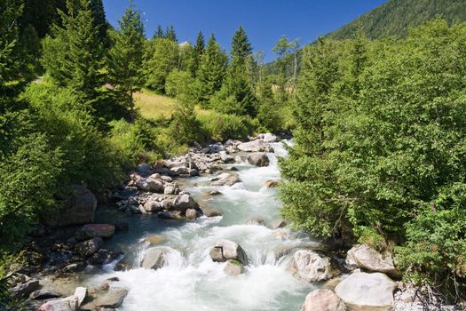 summer view of Vermigliana stream in Italian Alps. Photo taken with polarized filter