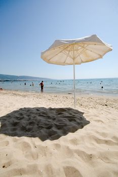 Umbrella and beach.