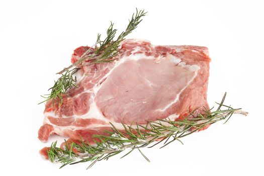 raw pork steak with rosemary isolated on white background