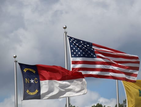 American and North Carolina flags blowing in the breeze.