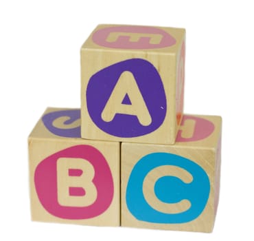 Wood building blocks, with the letters ABC, isolated on white background.