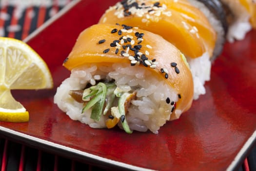 A complete sushi meal with chopsticks on tatami mat