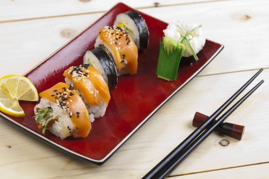 A complete sushi meal with chopsticks on tatami mat