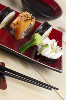 A complete sushi meal with chopsticks on tatami mat