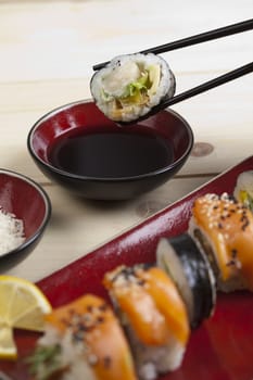 A complete sushi meal with chopsticks on tatami mat