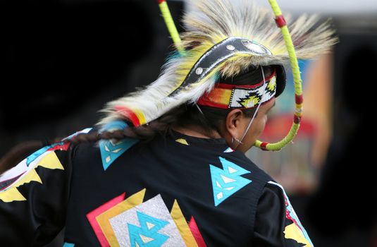 A Native American performs a traditional hoop dance