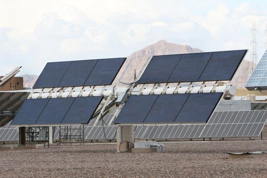 Solar panels in front of desert mountains in Arizona. Good for issues about power, air pollution, global warming, etc.