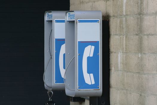 Close up of a phone booth in a park.