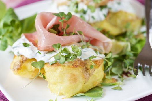 Delicious crispy baked potatoes with ham and creamcheese