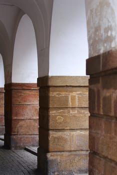 Medieval stone columns. A colonnade in the historical centre of Prague.
