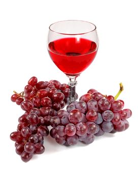 Glass of red wine and grapes clusters on a white background