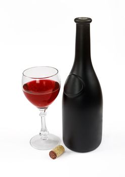 Red wine bottle, glass of wine and stopper on a white background