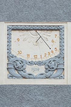 Sun dial on a wall of an old castle in Hluboka nad Vltavou, Czech Republic