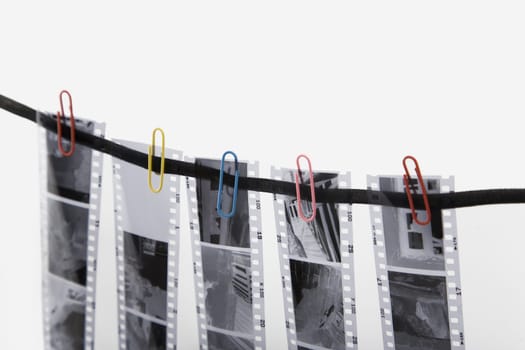 five film strip and colored paper clip