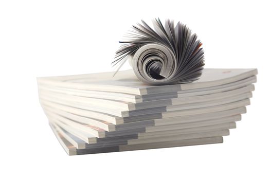 Magazine Roll isolated on white, on a bunch of other magazines