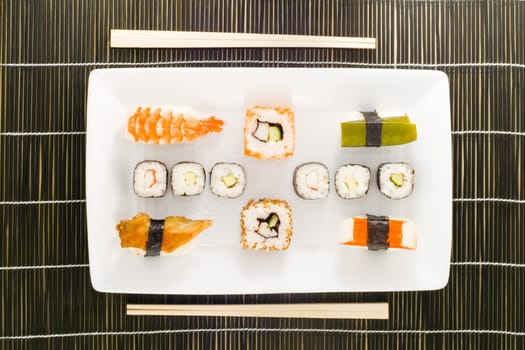 a plate with different kinds of sushi