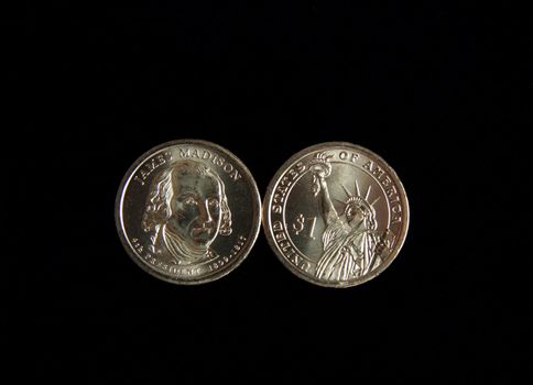A one dollar James Madison and statue of liberty US coin