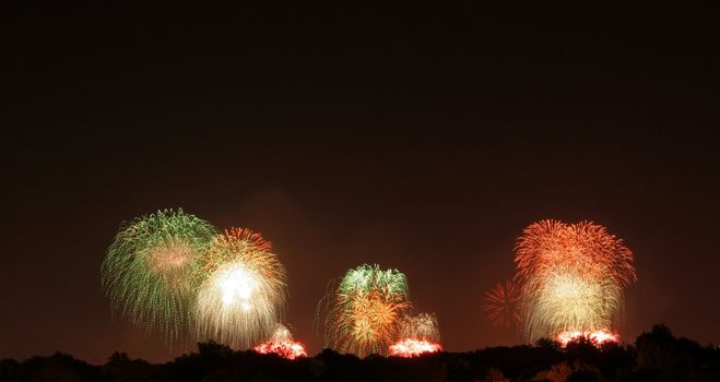 A firework display that was shot off in three locations