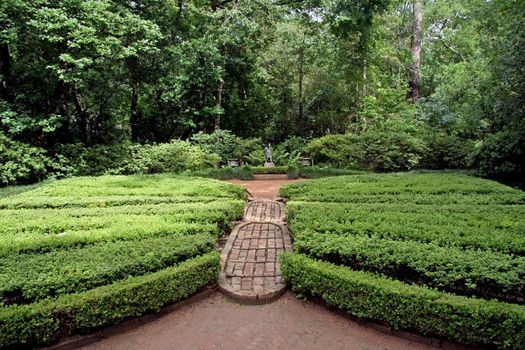 An english garden with a butterfly path and topiary wings