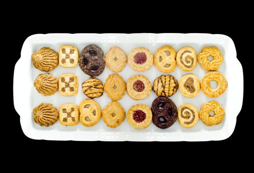 a white tray with an assortment of different kinds of teacakes