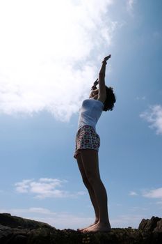 a beautiful woman doing yoga to show a healthy way to live a happy and relaxed lifestyle in a world full of stress