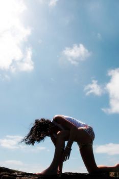 a beautiful woman doing yoga to show a healthy way to live a happy and relaxed lifestyle in a world full of stress