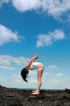 a beautiful woman doing yoga to show a healthy way to live a happy and relaxed lifestyle in a world full of stress