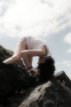 a beautiful woman doing yoga to show a healthy way to live a happy and relaxed lifestyle in a world full of stress