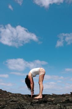 a beautiful woman doing yoga to show a healthy way to live a happy and relaxed lifestyle in a world full of stress