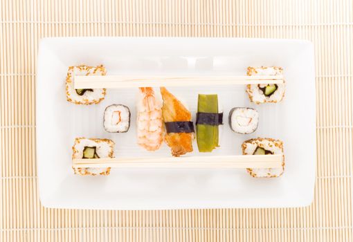 a plate with different kinds of sushi