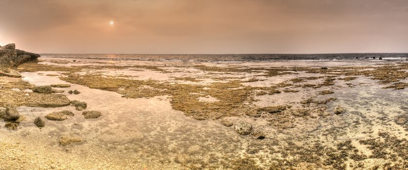 Panoramic coastline of sunset in yellow color.