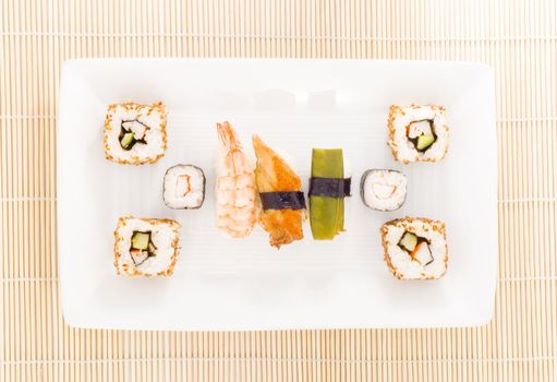 a plate with different kinds of sushi