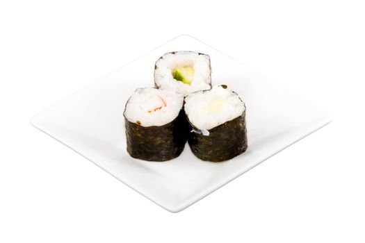 a square white plate with three pieces of sushi