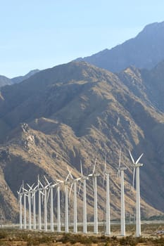 Wind Turbines in front of desert mountains