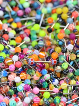 A giant pile of colorful tongue rings.