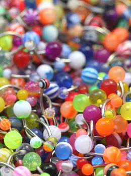 A giant pile of colorful belly rings.