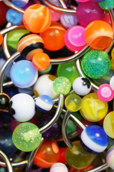 A giant pile of colorful belly rings.