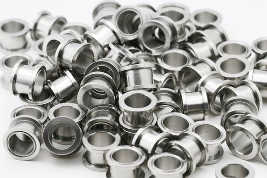 A big pile of screw on flesh tunnels. These are used in stretched ear lobes.