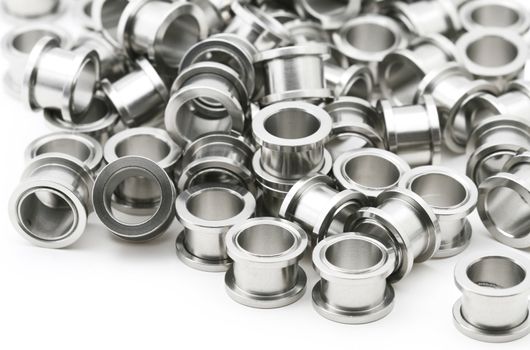 A big pile of screw on flesh tunnels. These are used in stretched ear lobes.