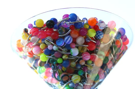 A martini glass full of navel rings