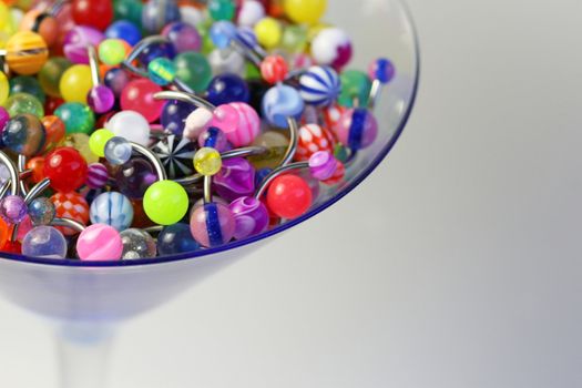 A martini glass full of navel rings