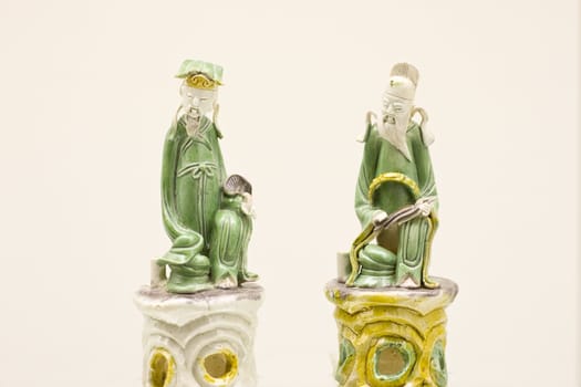 pair of figurines from the eight immortals in enamel on biscult,made in ming dynasty