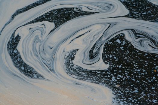 A shot of foam swirls on a lazy river create interesting patterns
